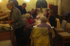 Enjoying the traditional Maundy Thursday meal at St Francis' Church.